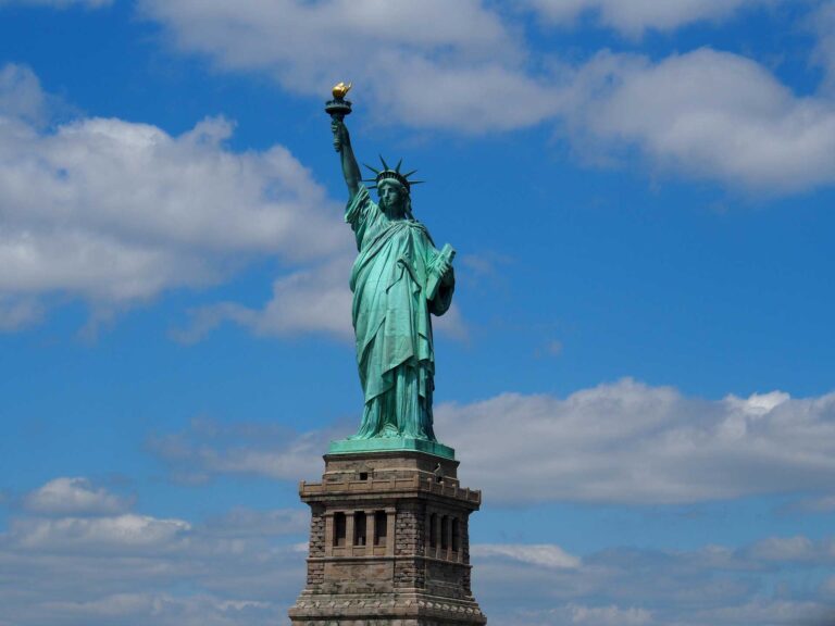 statue of liberty in new york city clear blue skies around the world top 5 cities in america