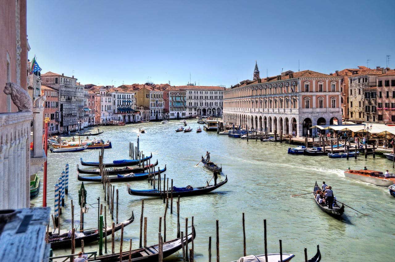 the grand canal in venice overlooking the buildings and gondolas in the canal, venice italy